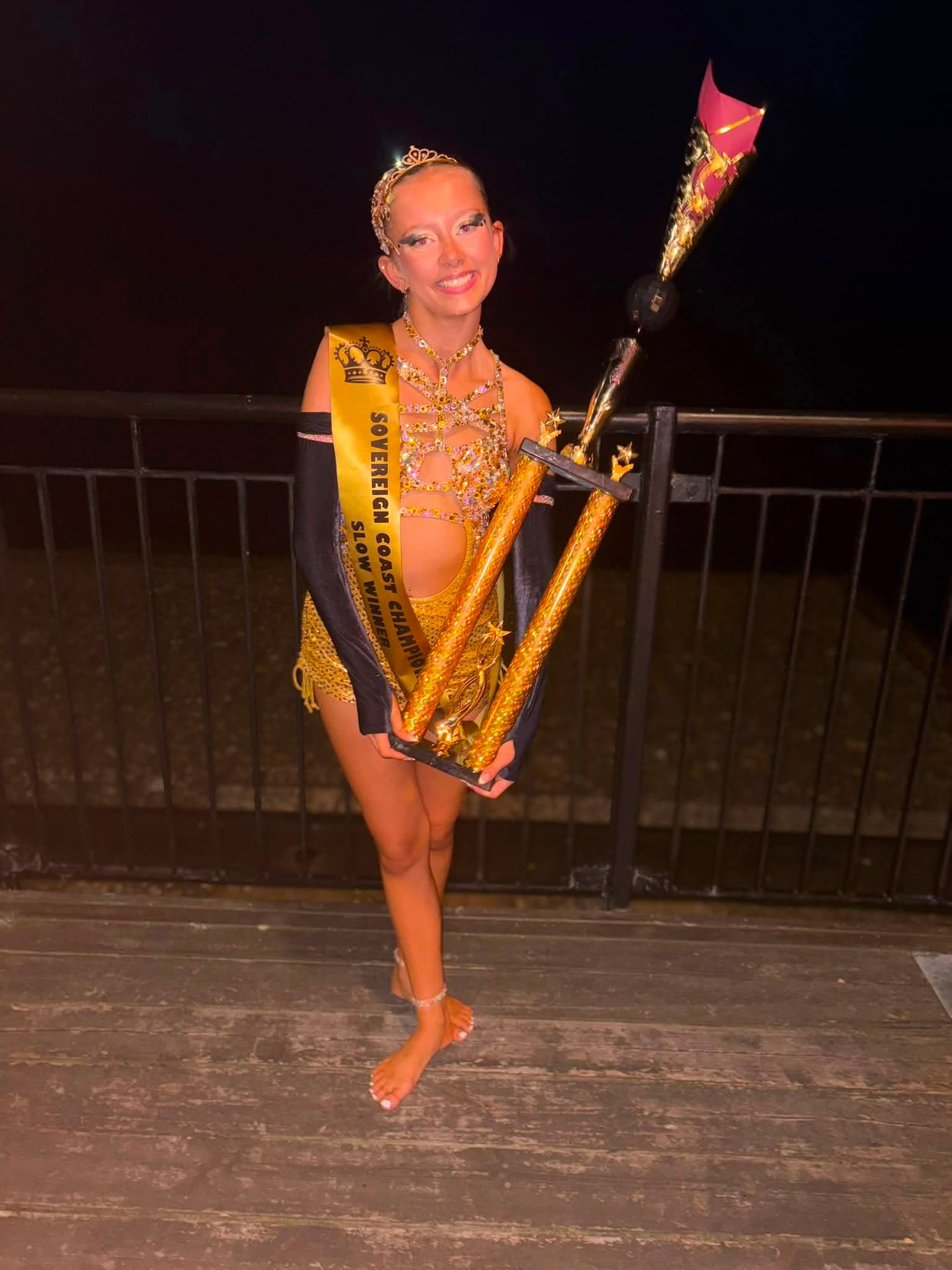 Slow champion with sash and trophy
