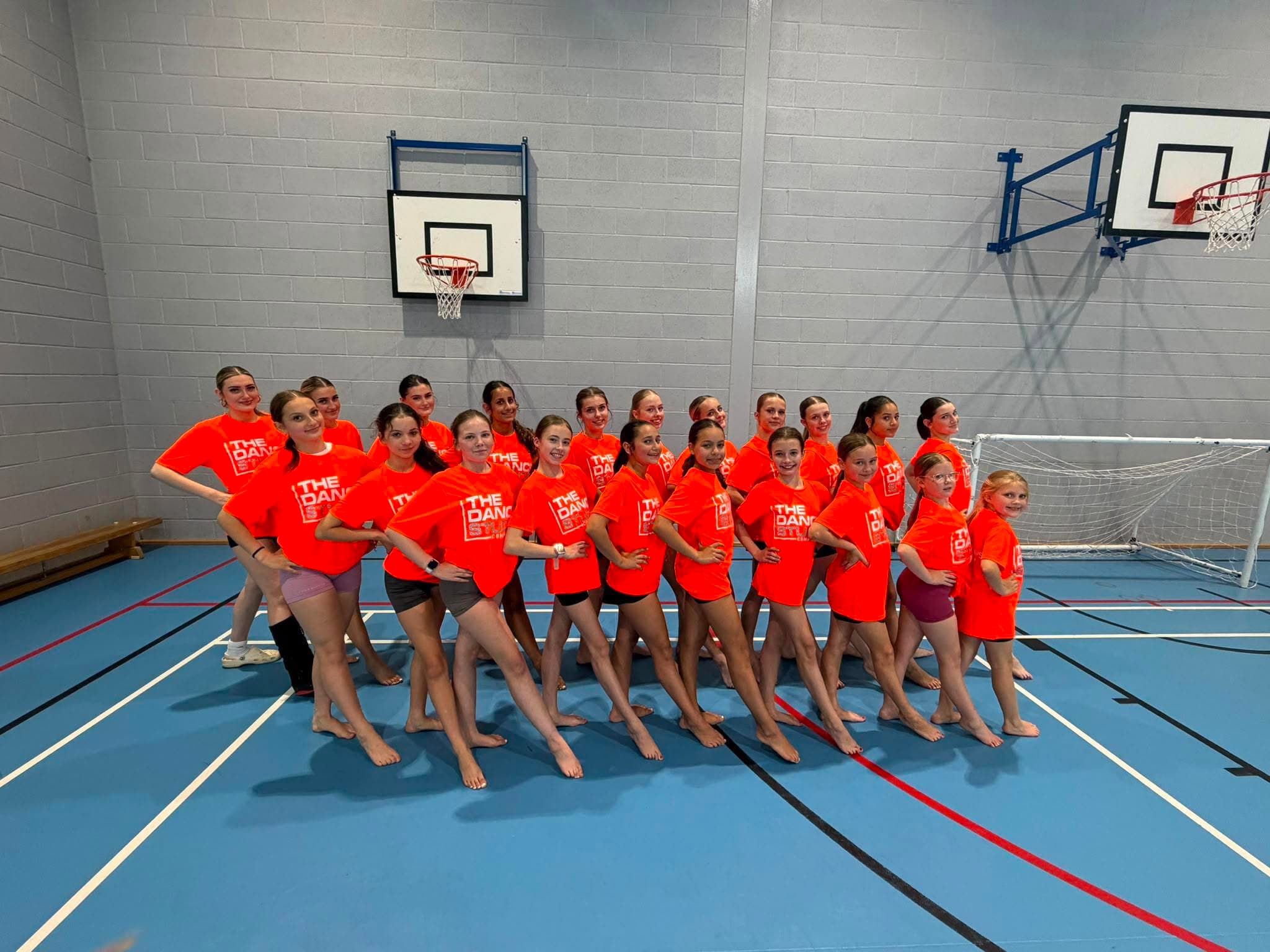 Studio group in orange merch